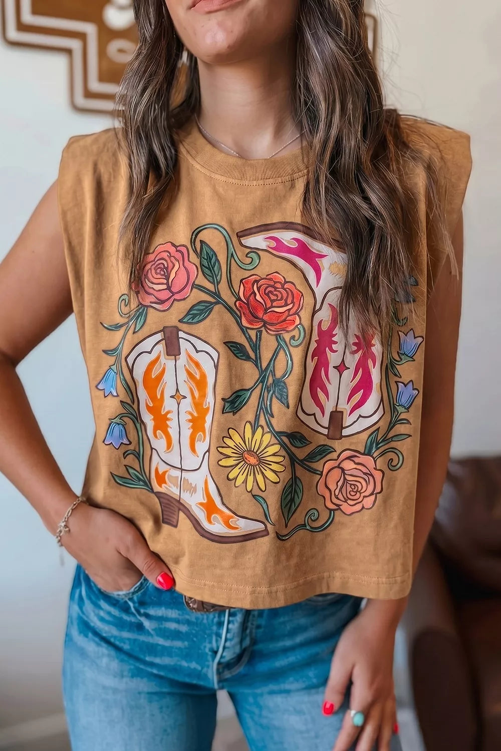 Taupe sleeveless tank top with western floral cowboy boot graphic and padded shoulders.