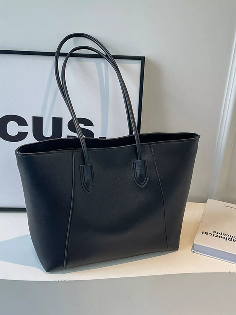 Chic structured black pu leather tote bag with clean silhouette and double handles.