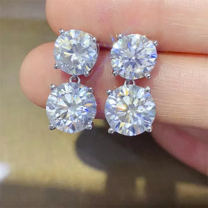 Silver double-drop stud earrings with round cubic zirconia stones.