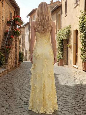 Yellow floral lace ruffled maxi dress with spaghetti straps and sheer overlay.