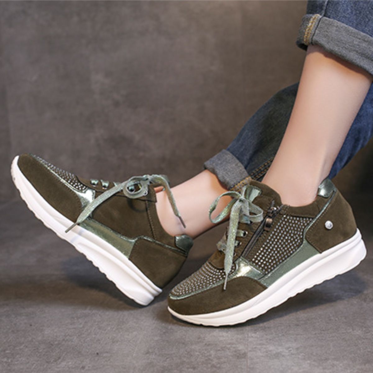 Khaki rhinestone embellished lace-up sneakers with a chunky sole and side zipper detail.