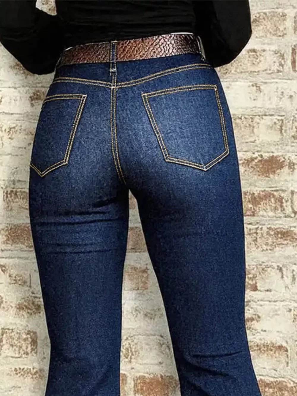 Chic high-rise flare jeans in dark wash denim with gold stitching and back pockets.