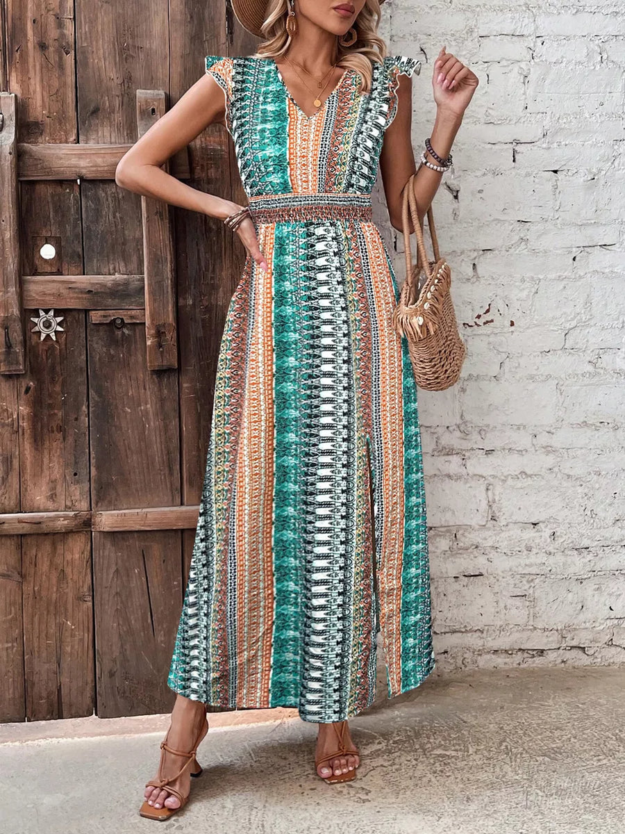 Bohemian maxi dress with ruffle sleeves, V-neck, and tribal print in green and orange.