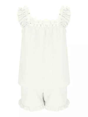 White polyester pajama set with ruffled straps and shorts.
