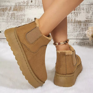 Caramel suede round toe platform ankle boots with faux fur lining and elastic side panels.