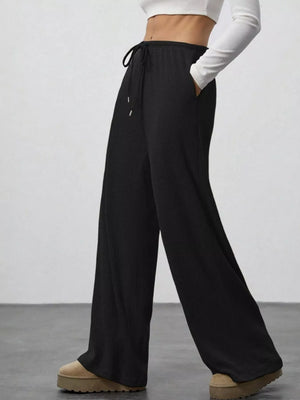 Black ribbed wide-leg pants with drawstring and pockets
