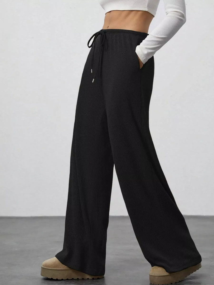 Black ribbed wide-leg pants with drawstring and pockets