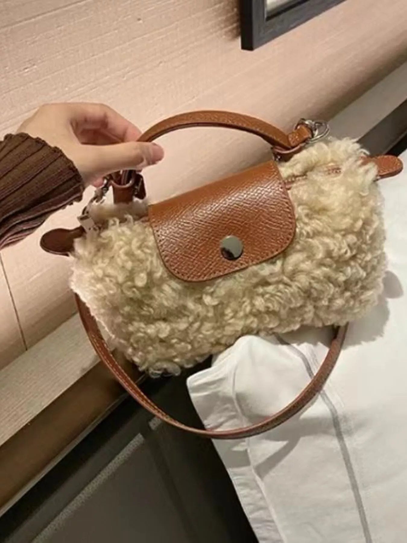 Textured mini crossbody bag in khaki with brown leather trim and strap.