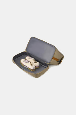 Loomirke holdall in tan with shoes inside, showing shoe compartment.