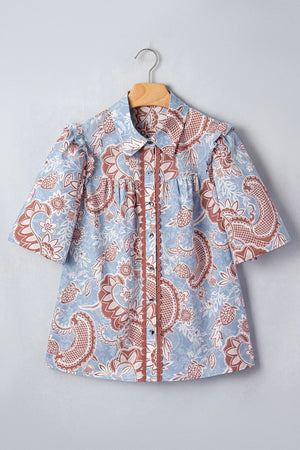 Blue cotton button-up shirt with floral print and scalloped trim detail
