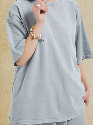 Oversized gray washed cotton tee with crew neck and short sleeves.