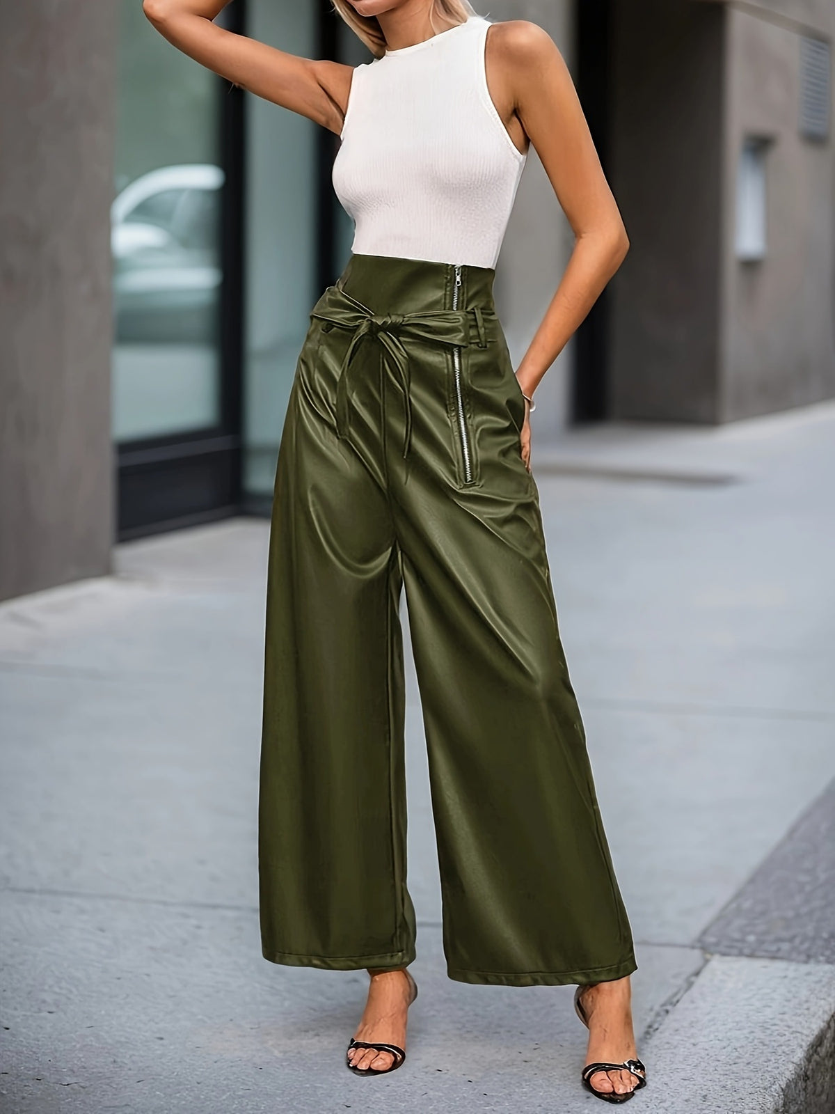 wide-leg pants in olive green featuring high-waisted and flared fit
