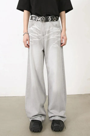 Bleached wash wide-leg denim trousers in gray with a relaxed fit and distressed detailing.