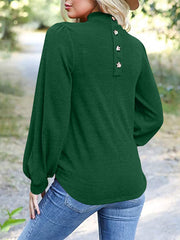 Dark green mock neck top with puff sleeves and button back detail
