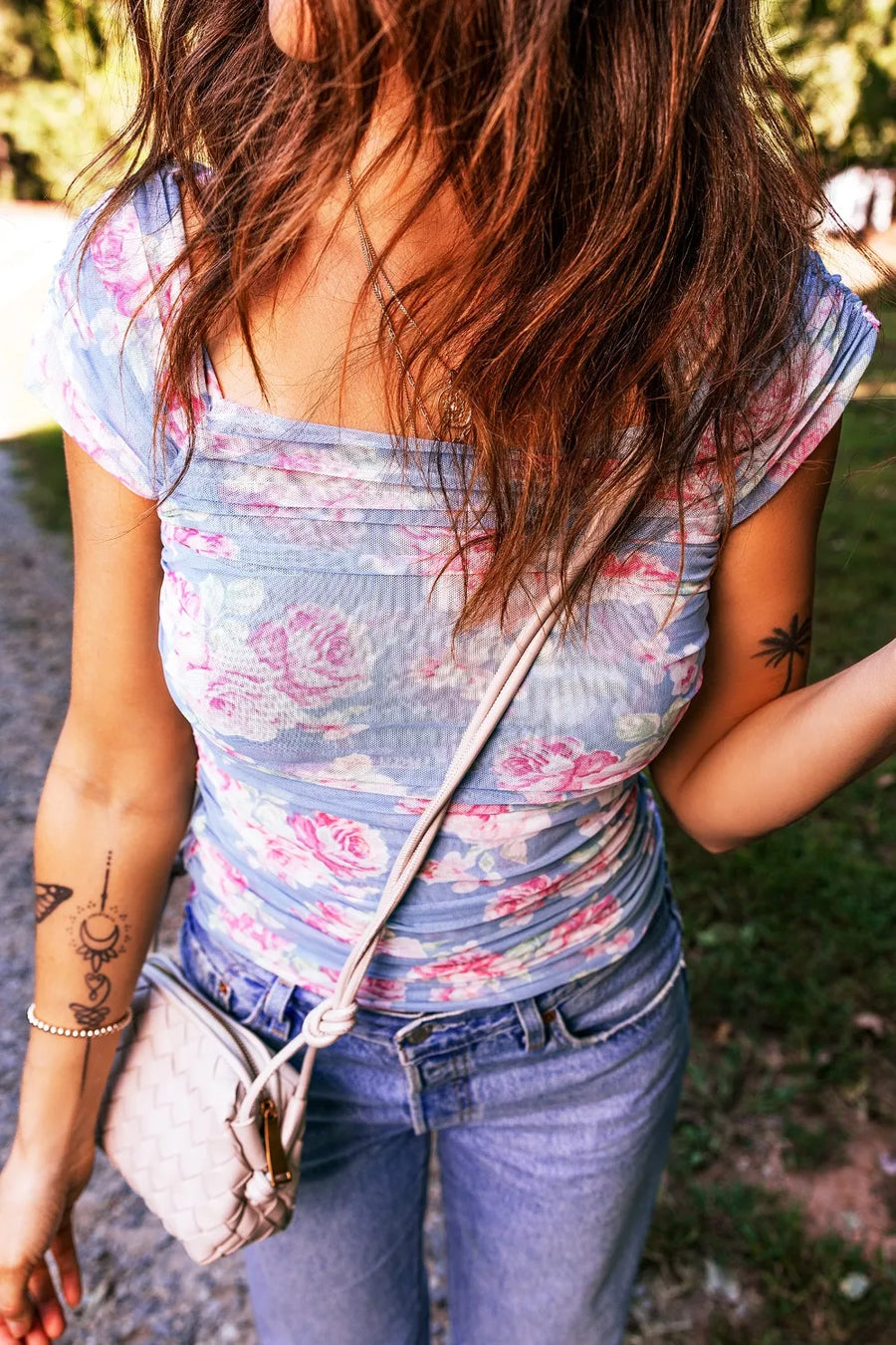 Square neck ruched floral mesh top with cap sleeves in blue and pink.