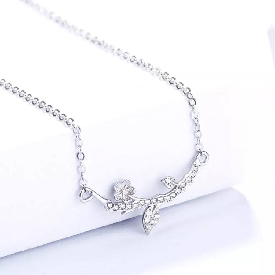 clear necklace featuring adjustable length and floral