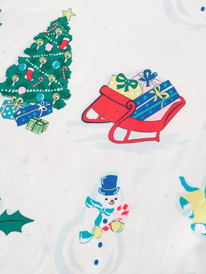 White children's pajama set with festive Christmas print of trees, snowmen, and gifts.
