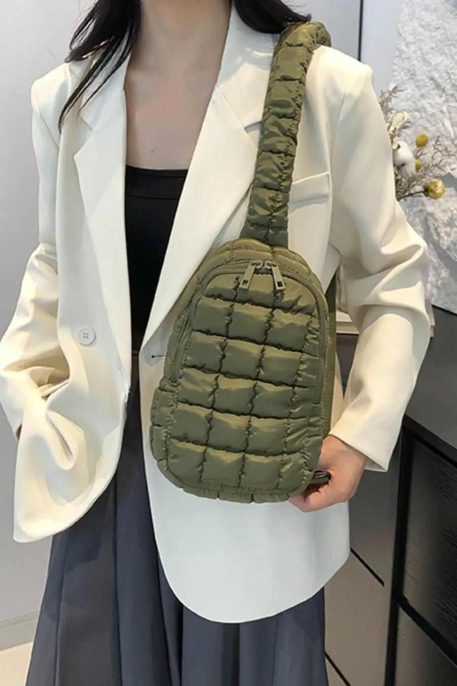 Padded sling bag in Army Green with quilted texture and top handle