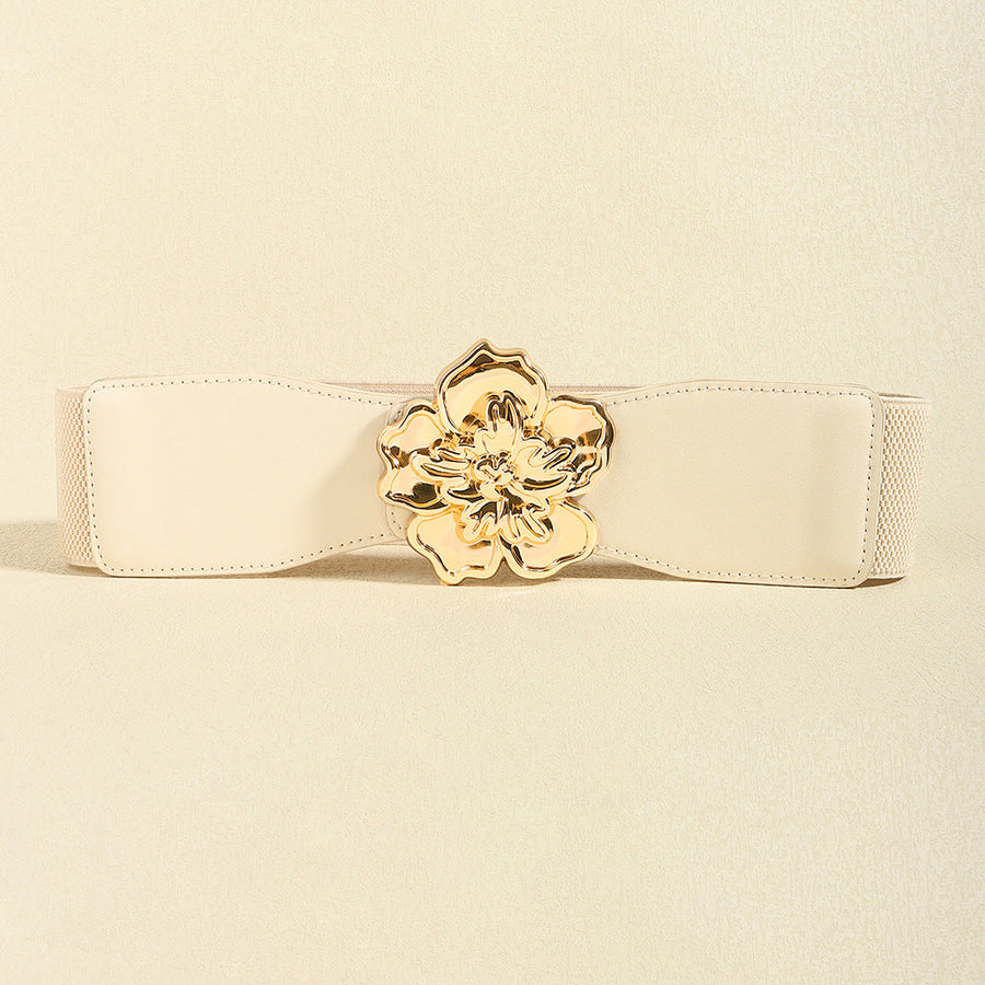 Ivory stretch cincher belt with gold floral buckle detail