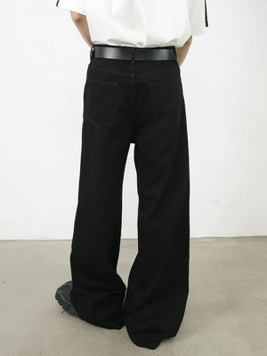 Black denim palazzo trousers with a wide leg and buttoned waist