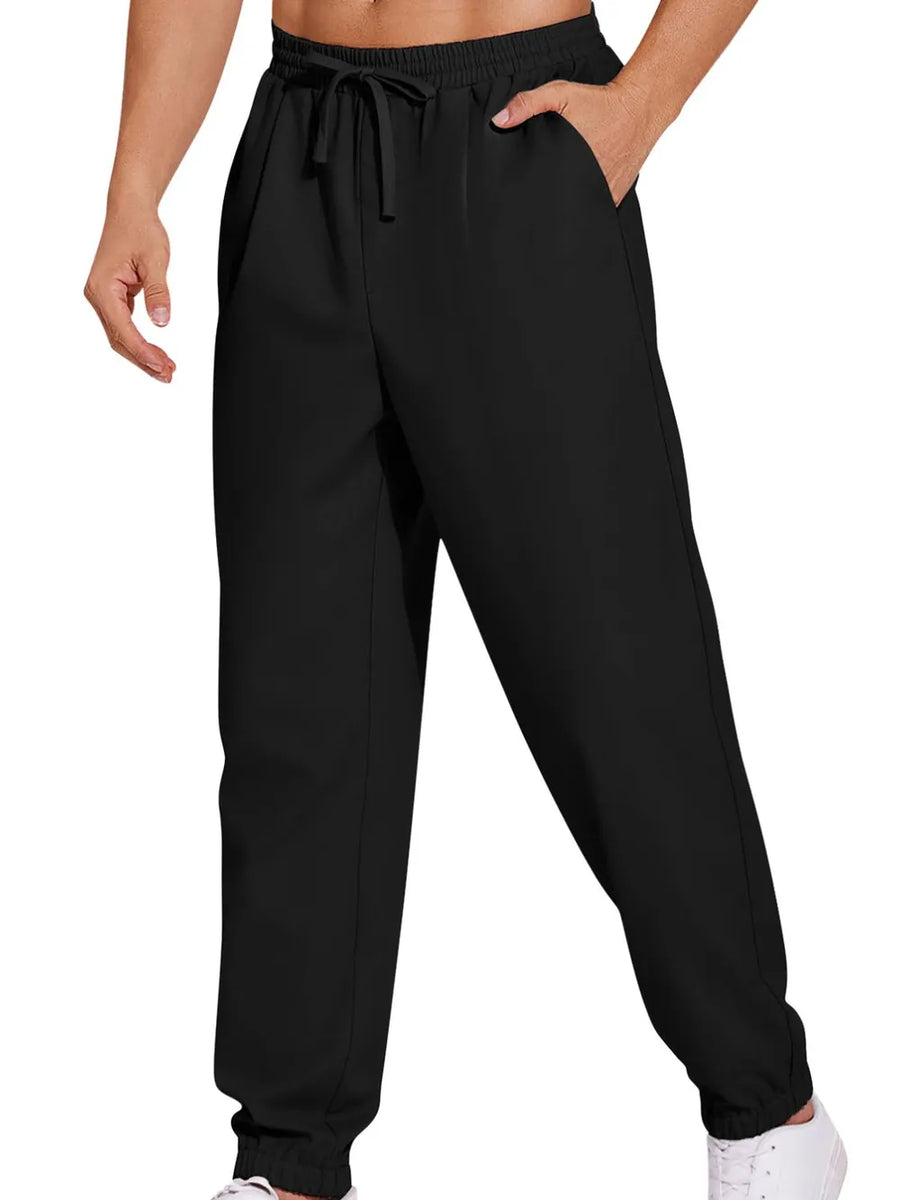 Black relaxed-fit cuffed trousers with drawstring waist and pockets