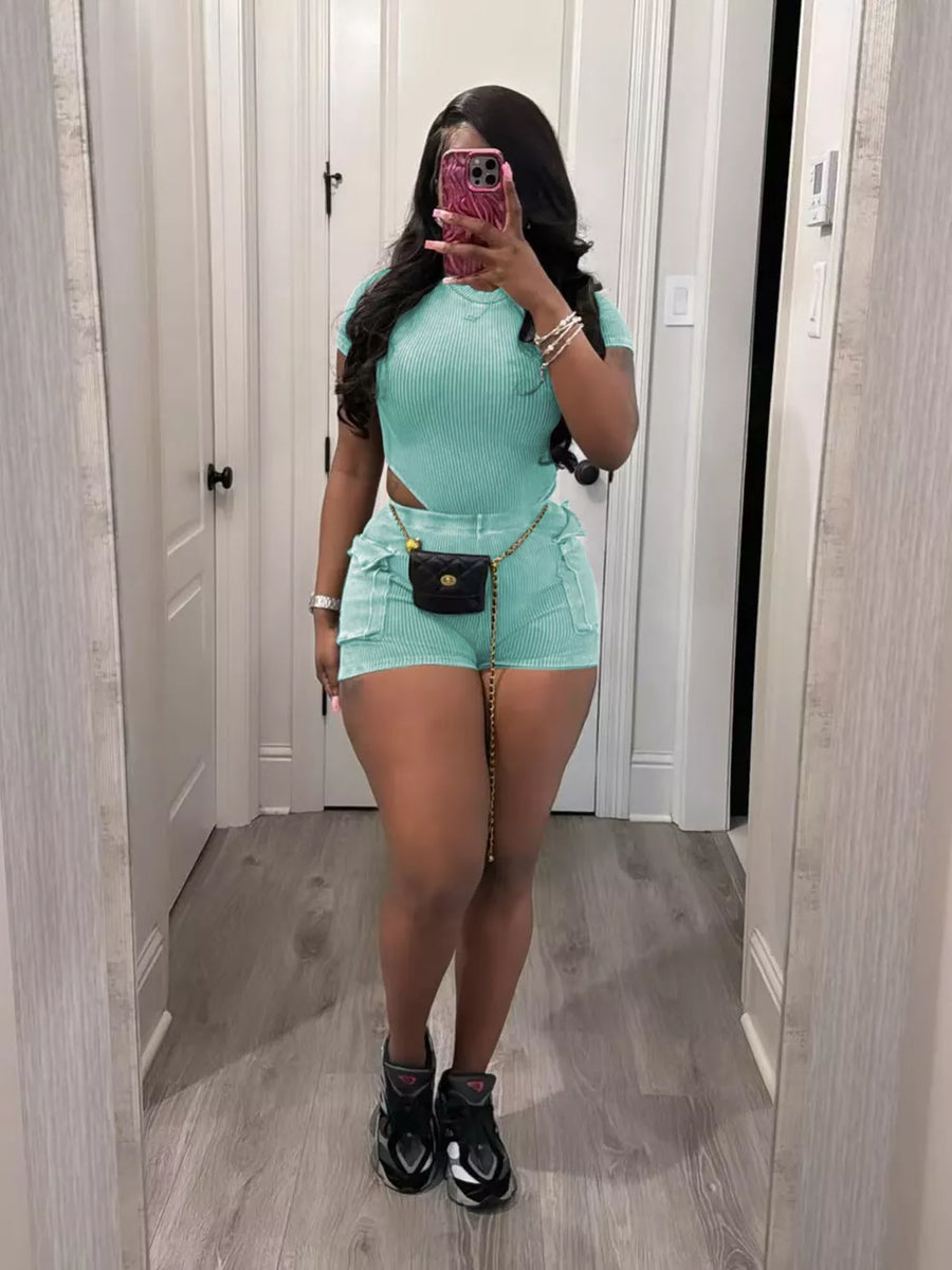 Sky blue ribbed crop top and pocket shorts set with a gold chain belt.