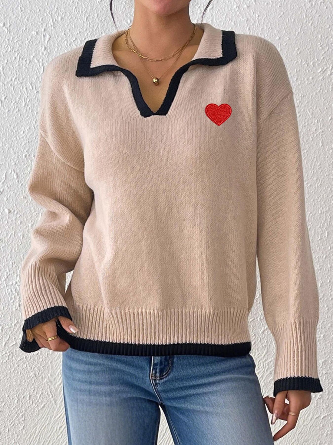 pullover sweater in beige featuring ribbed and relaxed fit