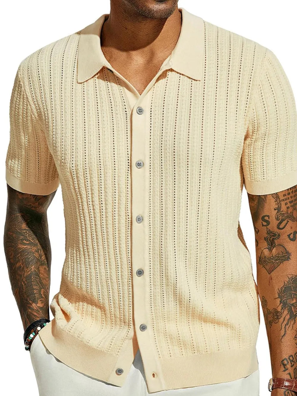 Cream textured knit polo shirt with openwork detail and button front.