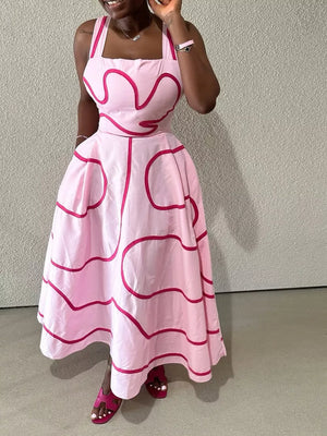 Pink midi dress with abstract pattern, square neck, and spaghetti straps.