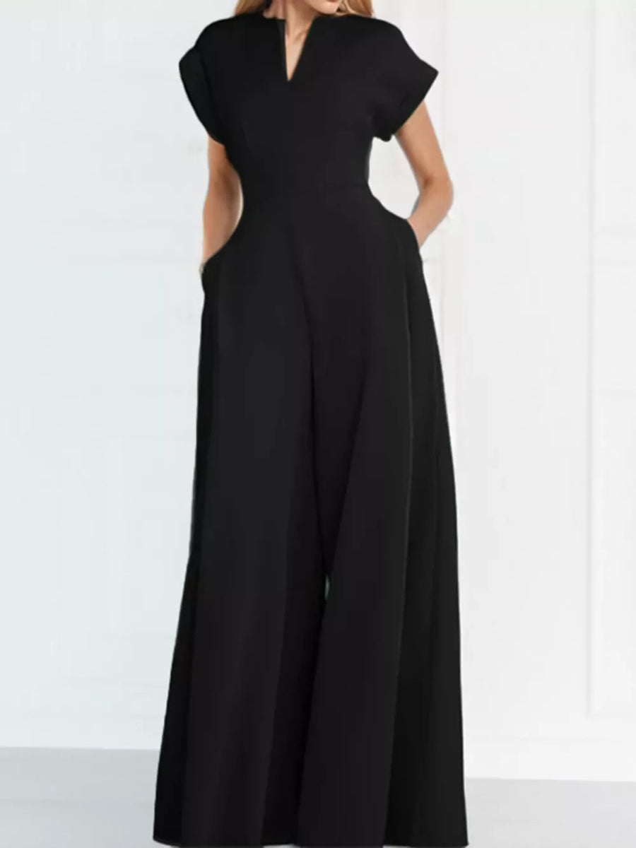Black wide-leg romper with V-neck, short sleeves, and pockets.