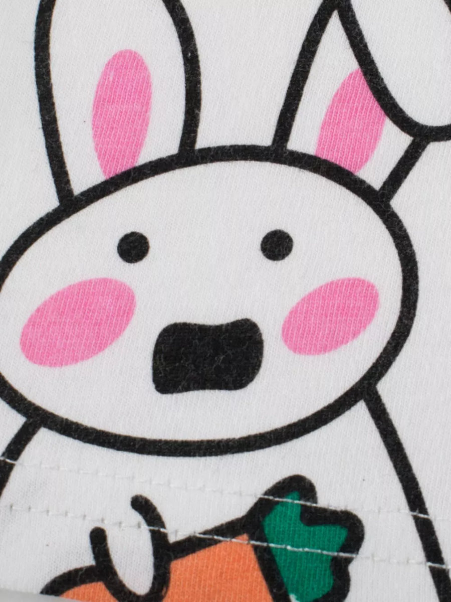 White t-shirt with a cartoon bunny graphic holding a carrot.