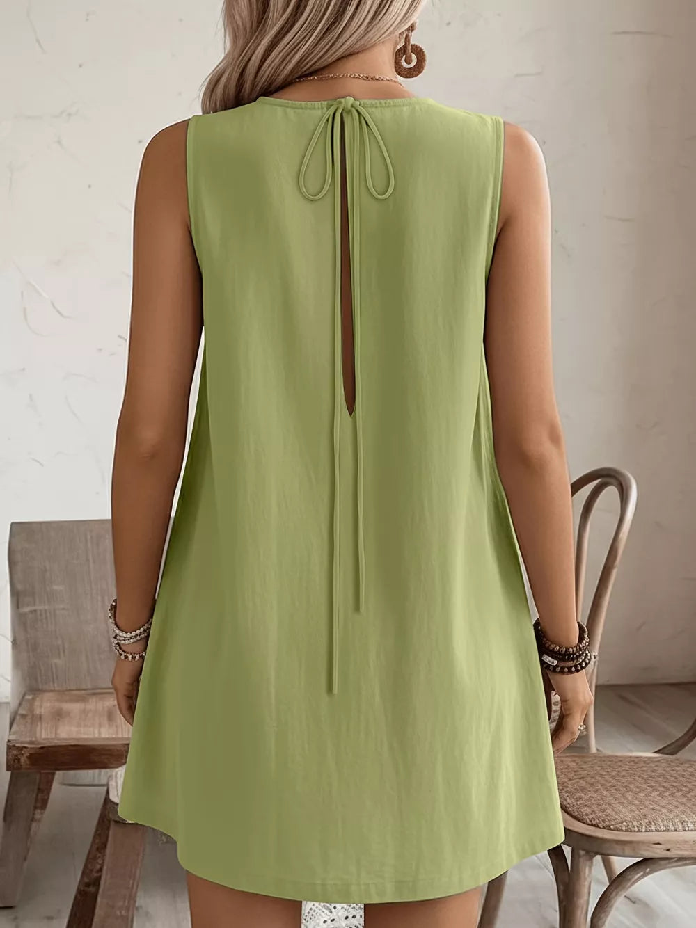 Yellow-Green sleeveless dress with back tie detail and keyhole cutout.