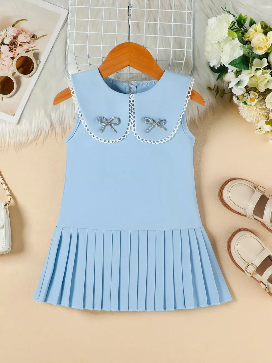 Blue toddler dress with Peter Pan collar, bow details, and pleated skirt.