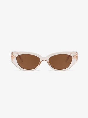 Geometric cat-eye sunglasses in clear with gold accents and brown lenses.