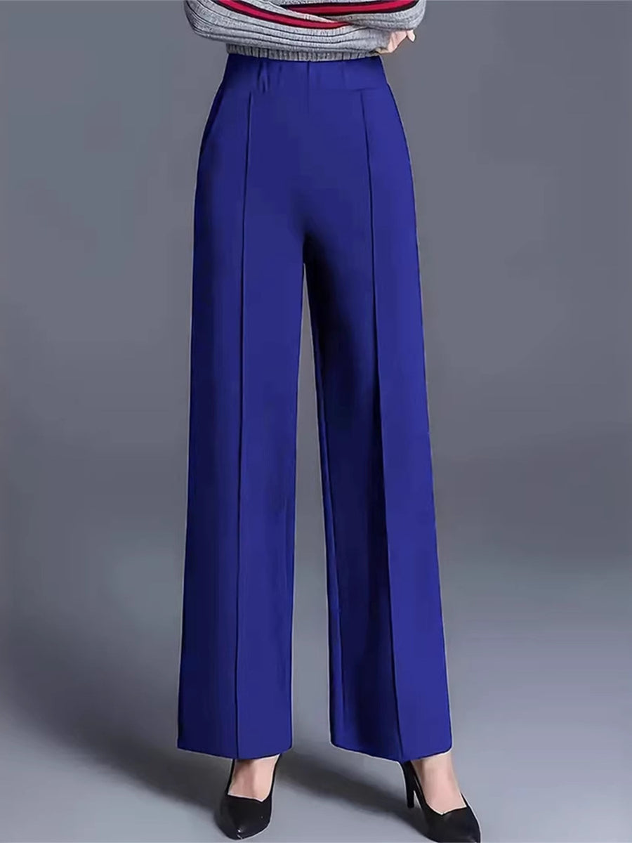 Blue high-waisted wide leg cotton trousers with front seams and pockets.