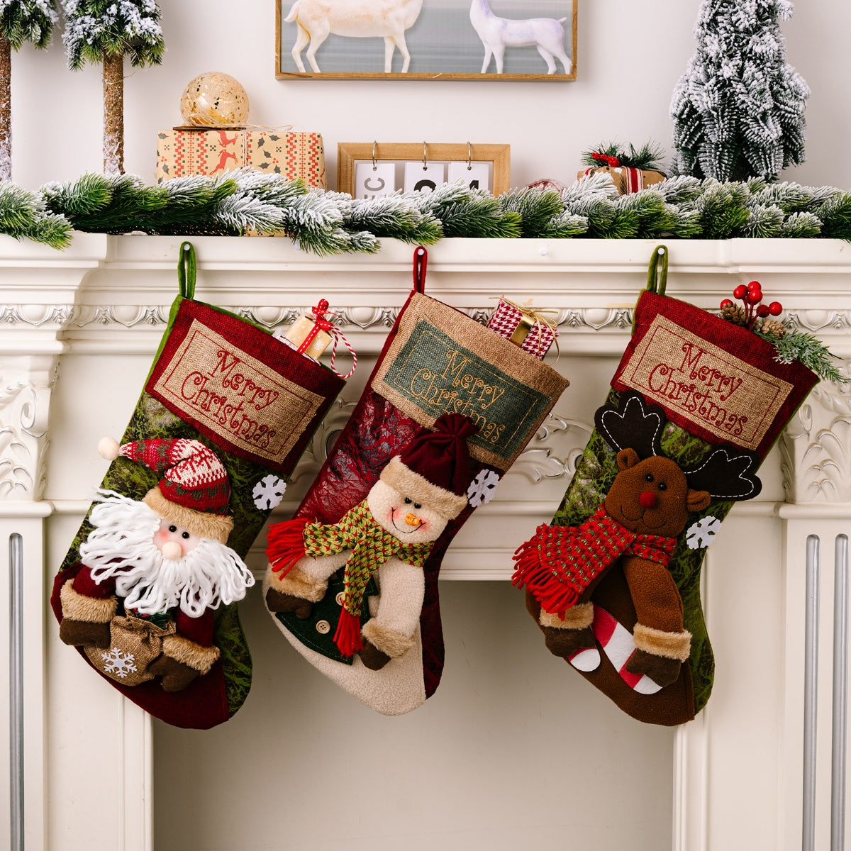 Embroidered Christmas stockings with Santa, snowman, and reindeer designs.