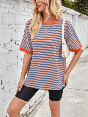 Striped Breton tee with orange trim and crew neck.