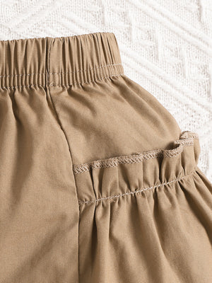 Baby camel shorts with elastic waist and ruffled hem detail