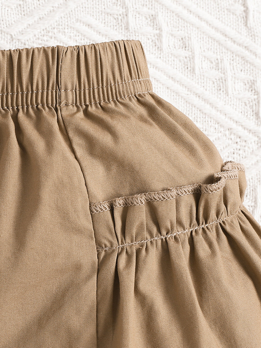 Baby camel shorts with elastic waist and ruffled hem detail