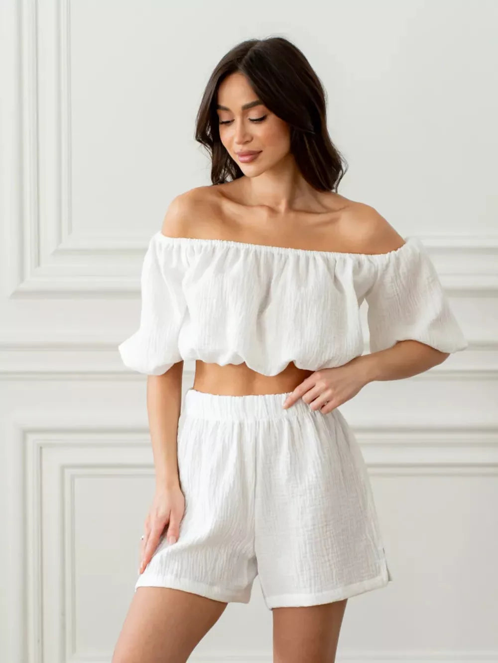 White off-shoulder cropped top and shorts set with textured cotton fabric