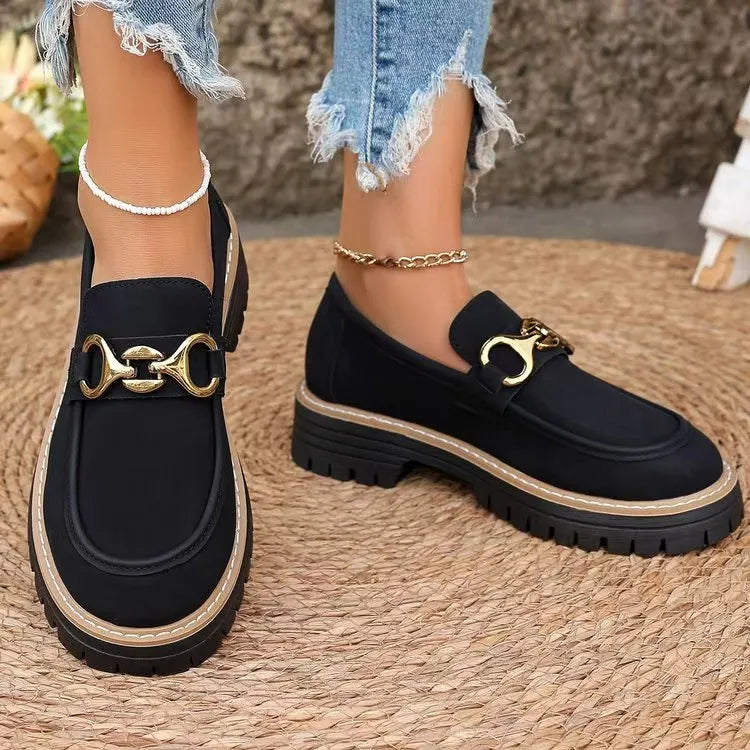 Black chunky chain detail platform loafers with gold hardware and lug sole.