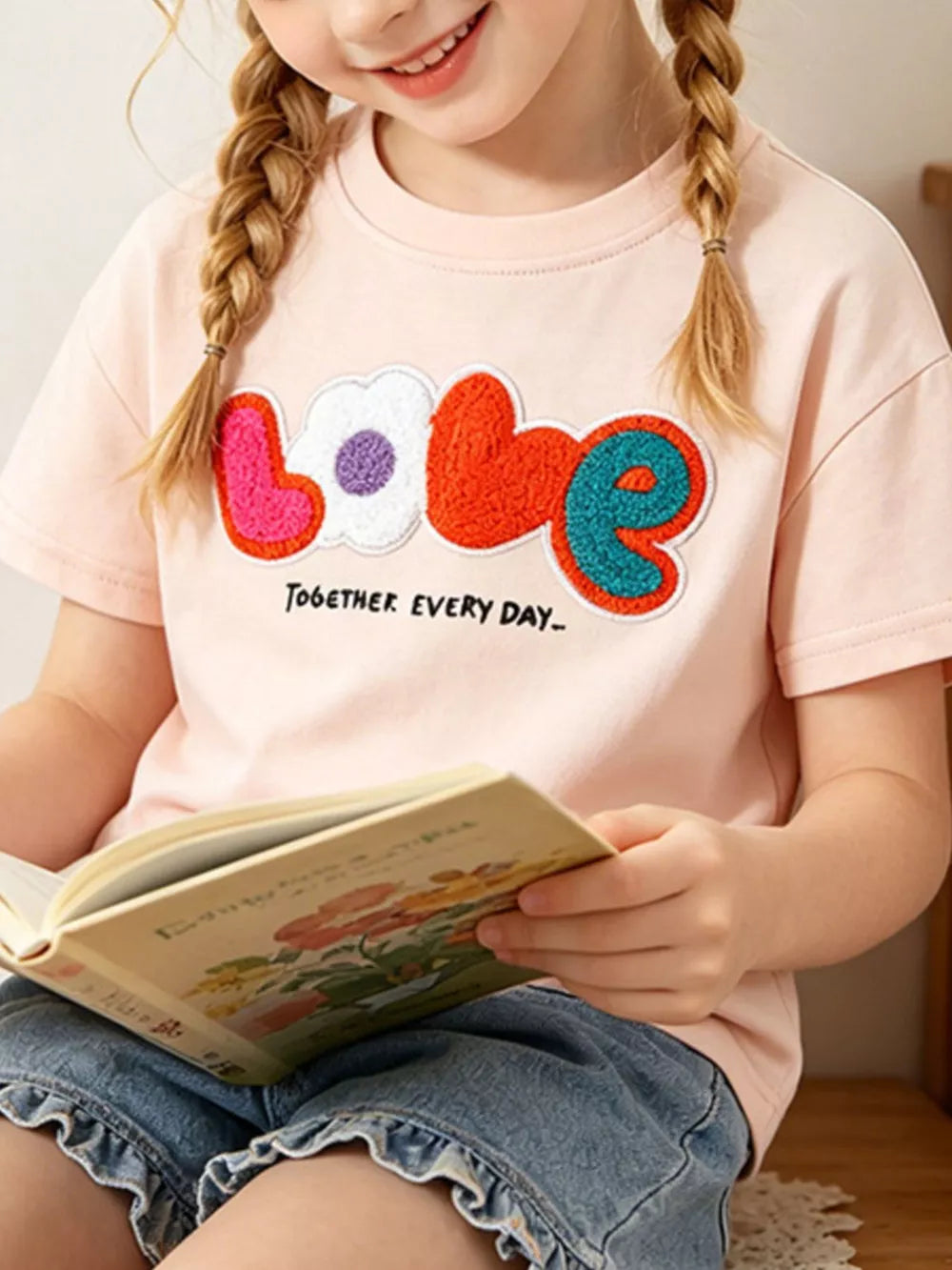 Playful Love graphic toddler t-shirt with crew neck.
