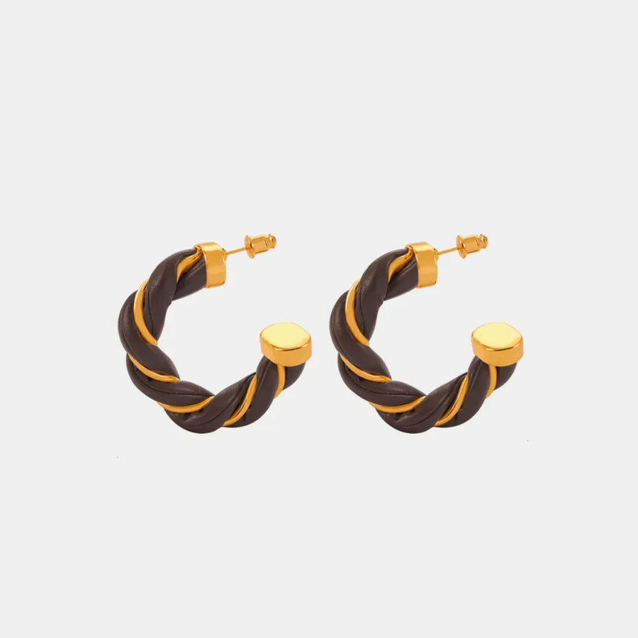 Braided leather and gold hoop earrings with a twisted design.