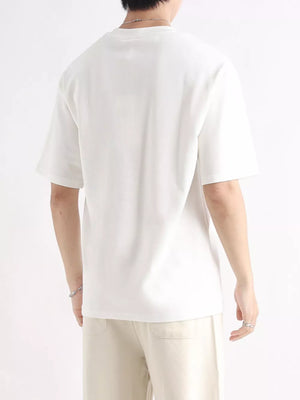 Men's white cotton t-shirt with relaxed fit and short sleeves.