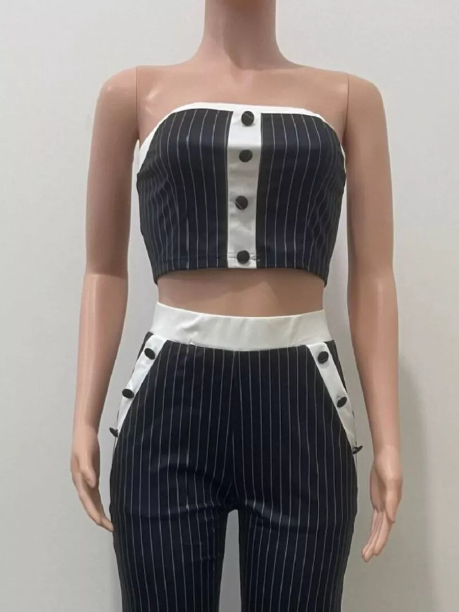 Black pinstripe strapless crop top and wide-leg pants set with button details.