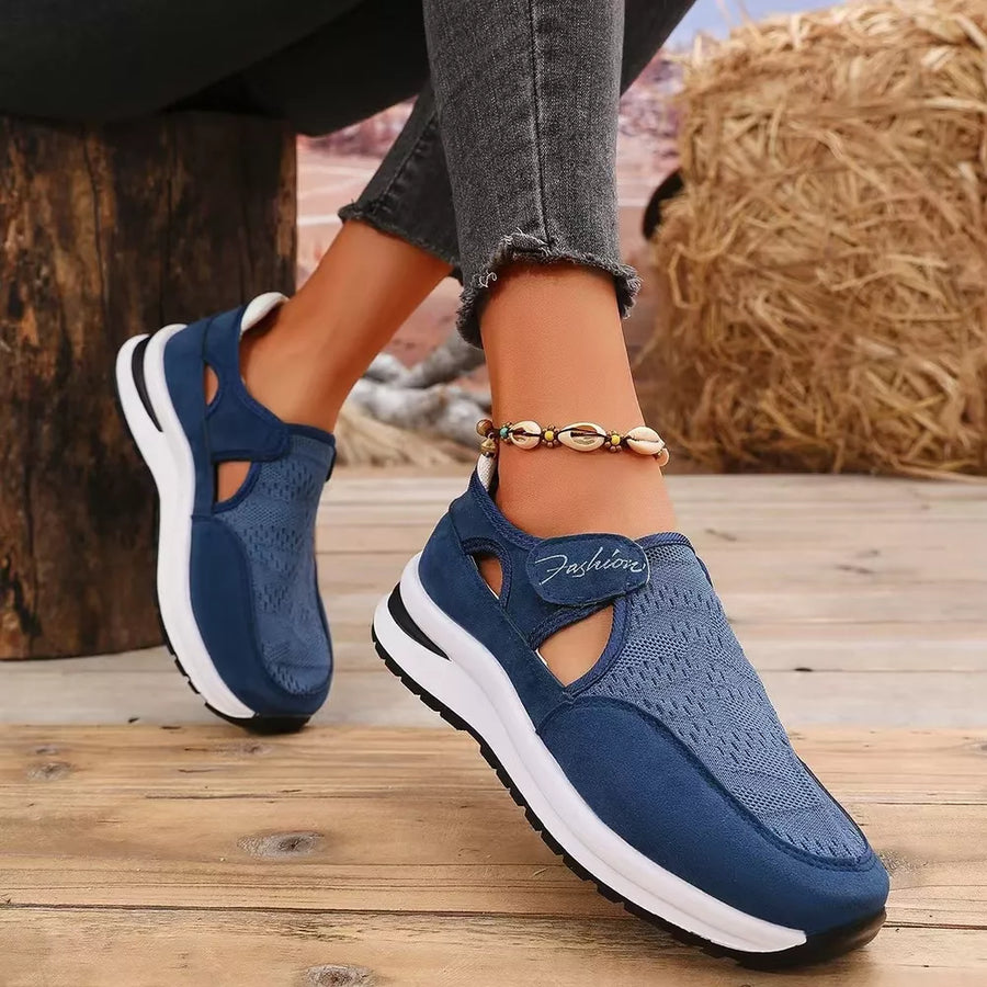 Blue breathable cutout slip-on sneakers with white soles and "Fashion" detail