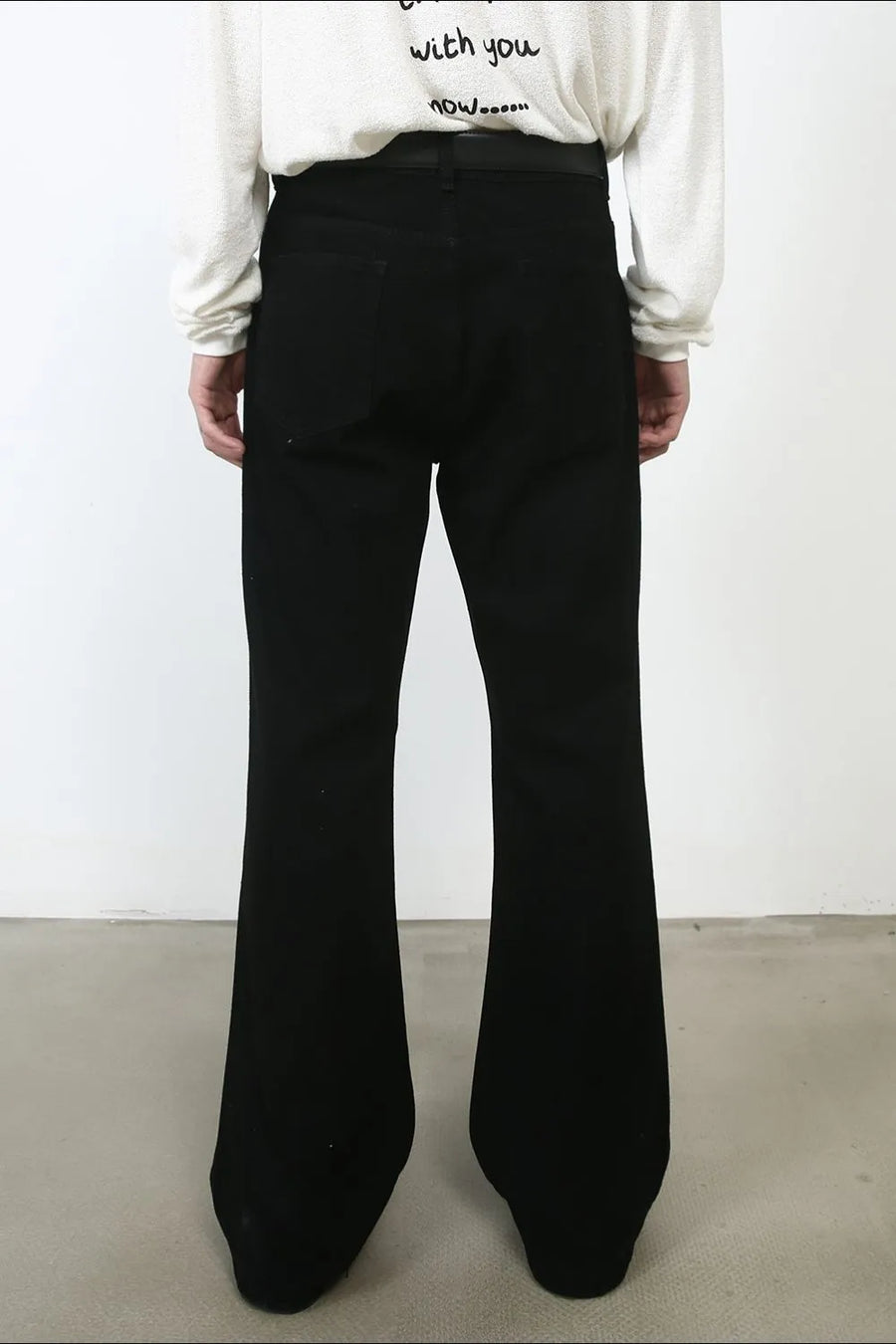 Black bootcut jeans with a flared leg, shown from the back.
