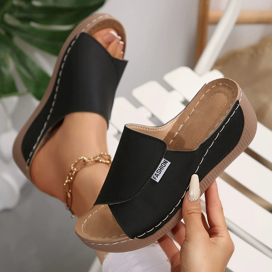 Black casual chic open-toe wedge sandals with white stitching detail and a "Fashion" label.