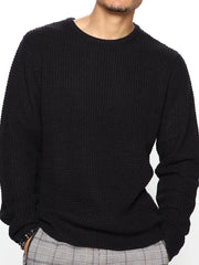 Black waffle knit crewneck sweater with relaxed fit and crew neckline.