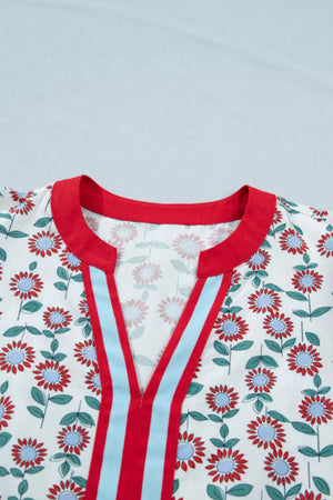 Cotton blouse with red and blue floral print, red collar, and red and blue striped V-neck detail.